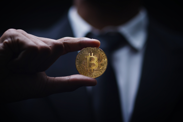 Man holding a bitcoin